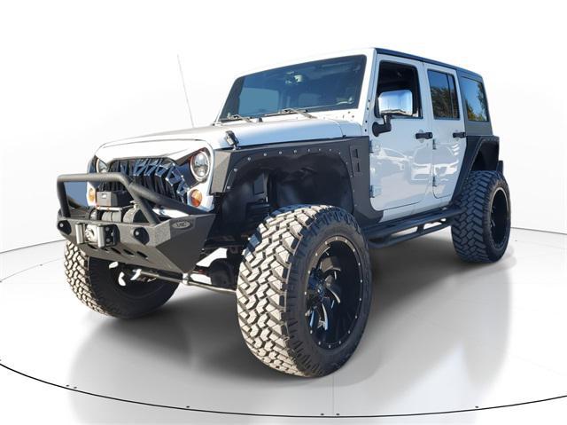 used 2013 Jeep Wrangler Unlimited car, priced at $16,998