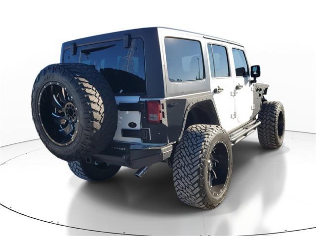 used 2013 Jeep Wrangler Unlimited car, priced at $16,998