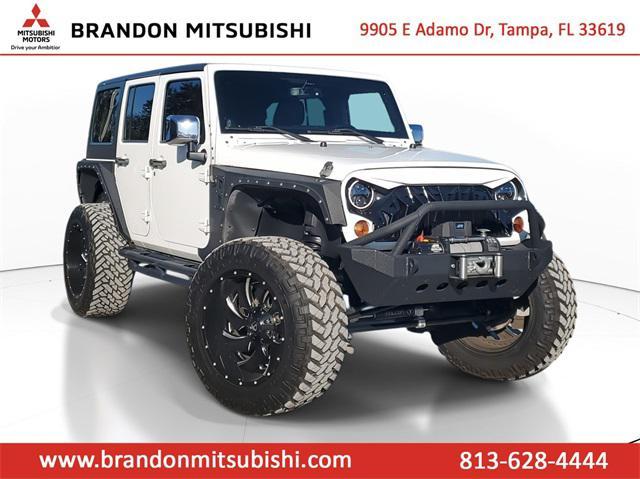 used 2013 Jeep Wrangler Unlimited car, priced at $16,998