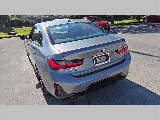 used 2023 BMW 330e car, priced at $30,673