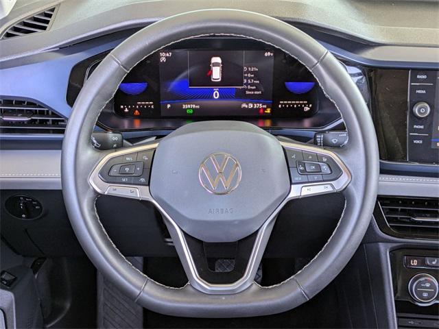 used 2024 Volkswagen Taos car, priced at $20,587