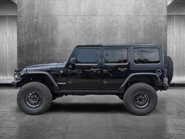used 2012 Jeep Wrangler Unlimited car, priced at $16,790