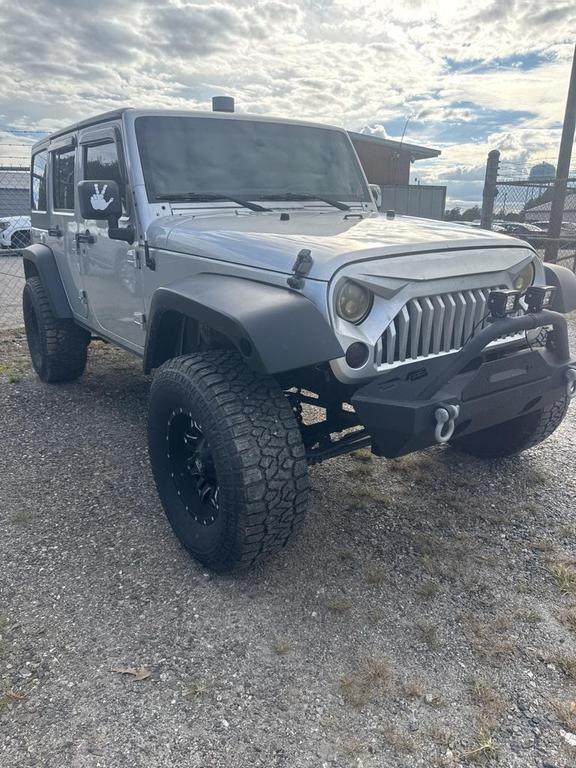 used 2011 Jeep Wrangler Unlimited car, priced at $13,998