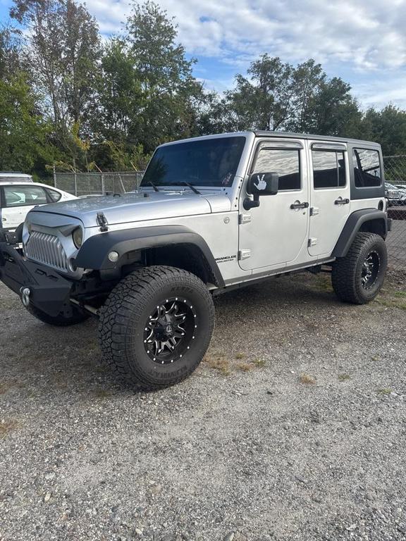 used 2011 Jeep Wrangler Unlimited car, priced at $13,998