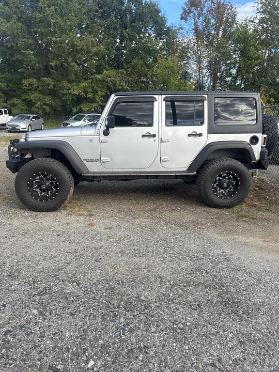 used 2011 Jeep Wrangler Unlimited car, priced at $13,998