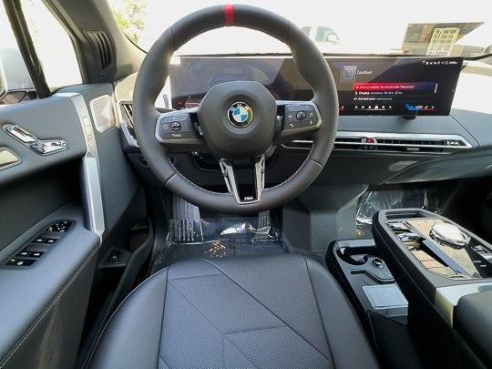 new 2025 BMW iX car, priced at $118,225