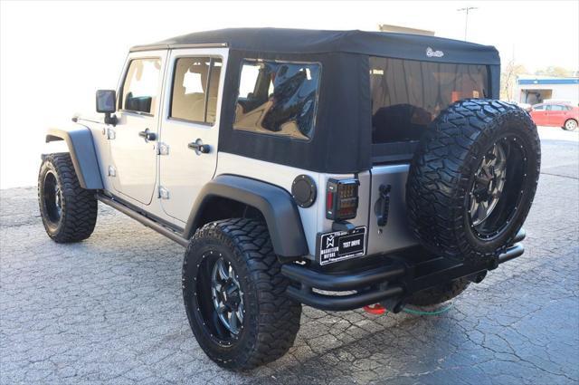 used 2014 Jeep Wrangler Unlimited car, priced at $18,997