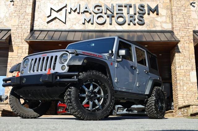 used 2014 Jeep Wrangler Unlimited car, priced at $18,997