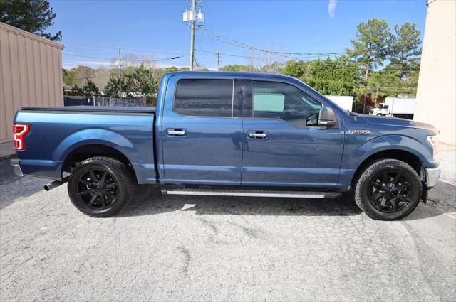 used 2018 Ford F-150 car, priced at $23,497