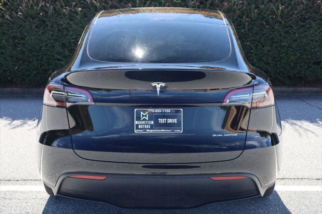 used 2023 Tesla Model Y car, priced at $27,497