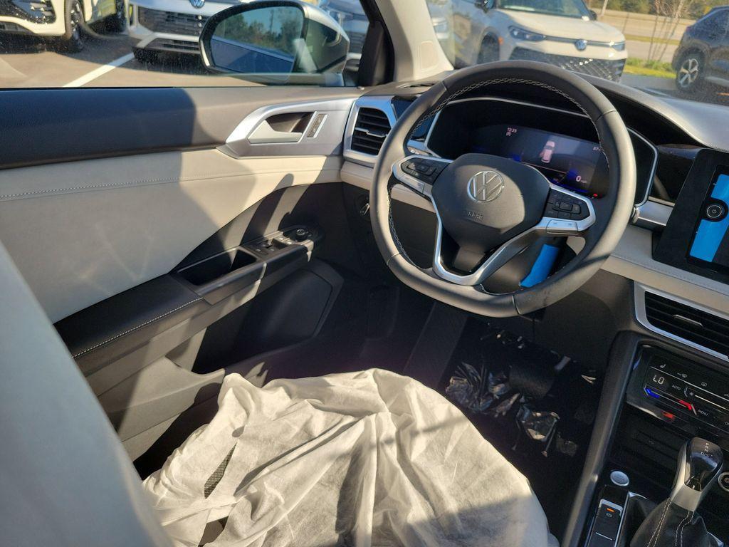 new 2025 Volkswagen Taos car, priced at $27,027