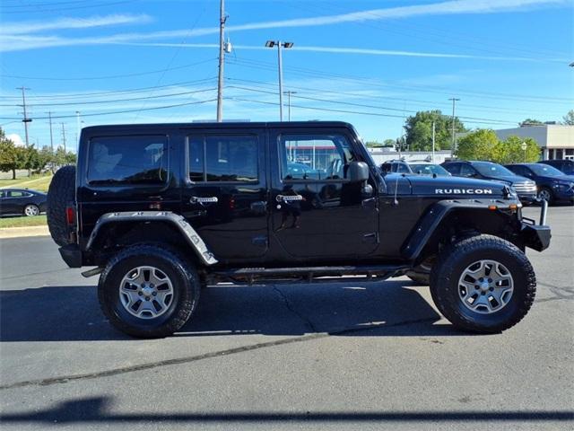 used 2014 Jeep Wrangler Unlimited car, priced at $13,234