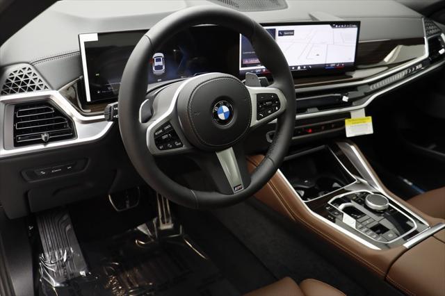 new 2025 BMW X6 car, priced at $77,875