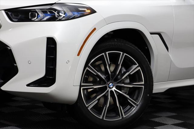 new 2025 BMW X6 car, priced at $77,875