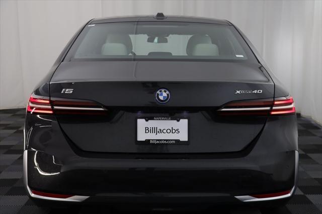 used 2025 BMW i5 car, priced at $68,977