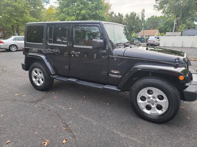 used 2014 Jeep Wrangler Unlimited car, priced at $16,995