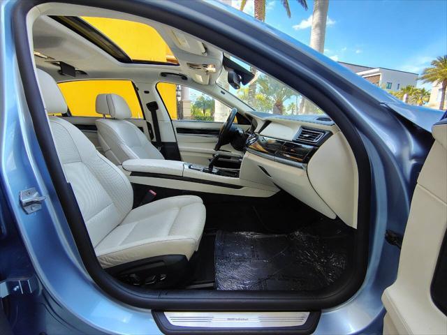 used 2014 BMW 750 car, priced at $34,999