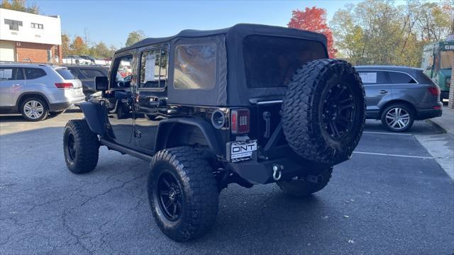 used 2015 Jeep Wrangler Unlimited car, priced at $19,899