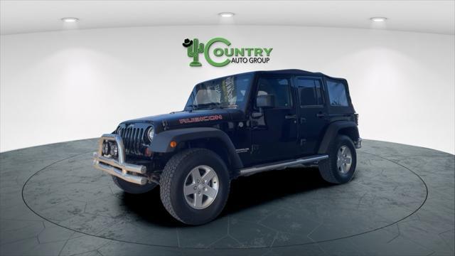 used 2011 Jeep Wrangler Unlimited car, priced at $14,500