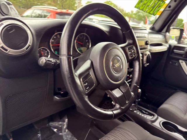 used 2011 Jeep Wrangler Unlimited car, priced at $13,995