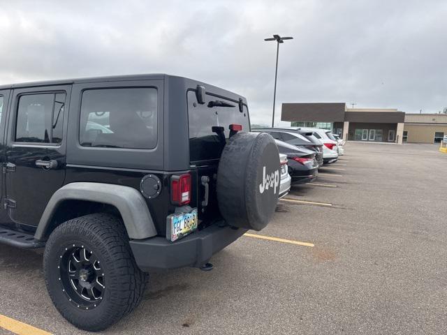 used 2014 Jeep Wrangler Unlimited car, priced at $14,899