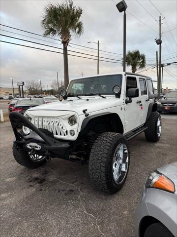 used 2012 Jeep Wrangler Unlimited car, priced at $14,988