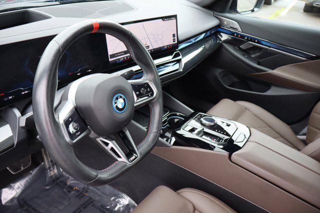 used 2024 BMW i5 car, priced at $58,888