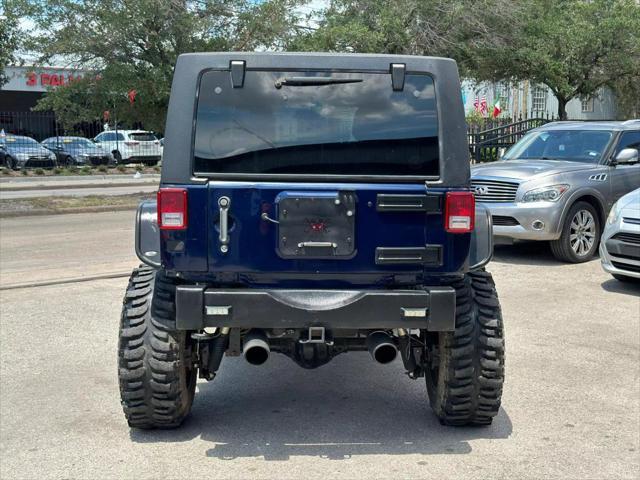 used 2013 Jeep Wrangler Unlimited car, priced at $22,995