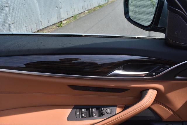 used 2023 BMW 530 car, priced at $27,393