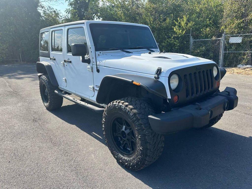 used 2013 Jeep Wrangler Unlimited car, priced at $15,900