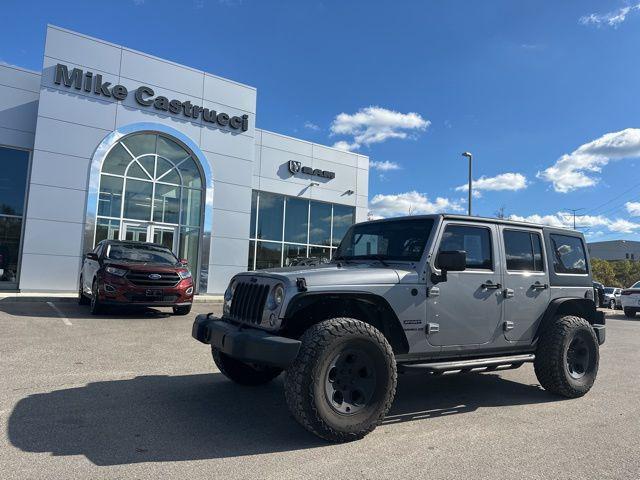 used 2014 Jeep Wrangler Unlimited car, priced at $17,634