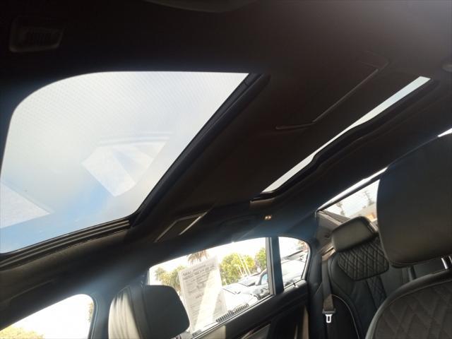 used 2022 BMW 750 car, priced at $59,977