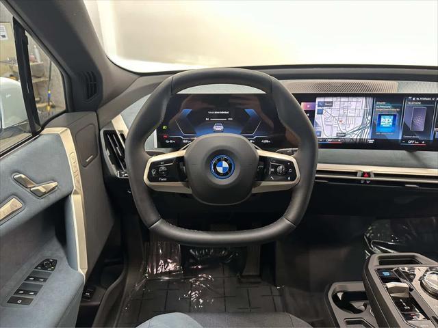 new 2024 BMW iX car, priced at $98,695