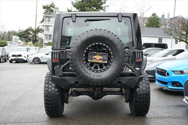 used 2014 Jeep Wrangler car, priced at $23,995