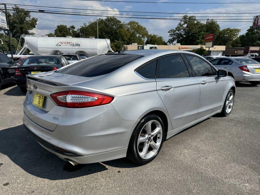 used 2014 Ford Fusion car, priced at $4,900