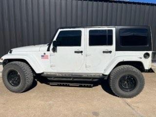 used 2014 Jeep Wrangler Unlimited car, priced at $24,979