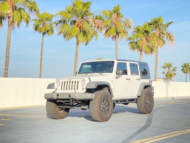 used 2014 Jeep Wrangler Unlimited car, priced at $13,999