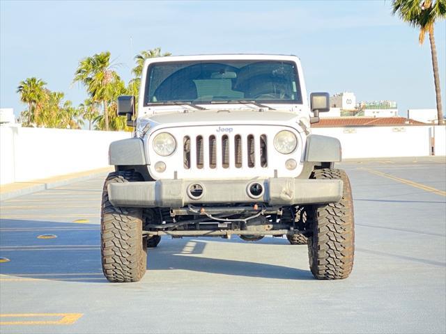 used 2014 Jeep Wrangler Unlimited car, priced at $13,999