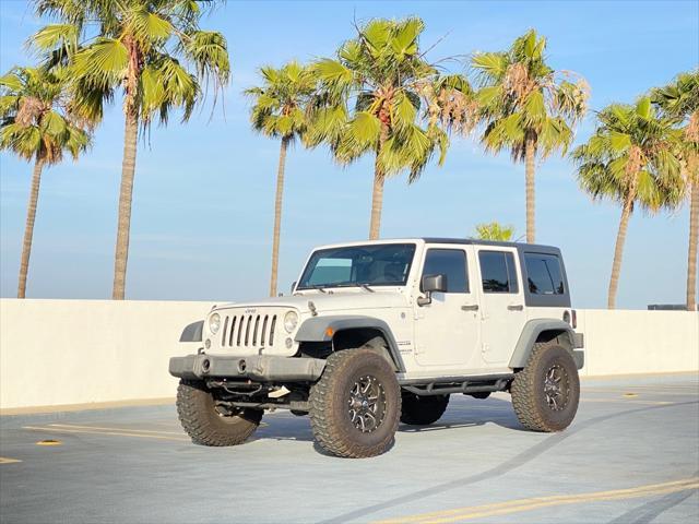 used 2014 Jeep Wrangler Unlimited car, priced at $13,999