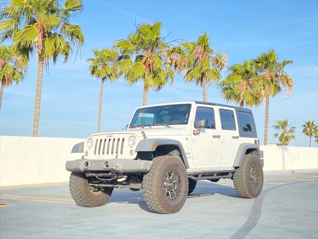 used 2014 Jeep Wrangler Unlimited car, priced at $13,999