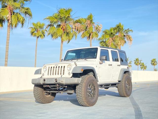 used 2014 Jeep Wrangler Unlimited car, priced at $13,999