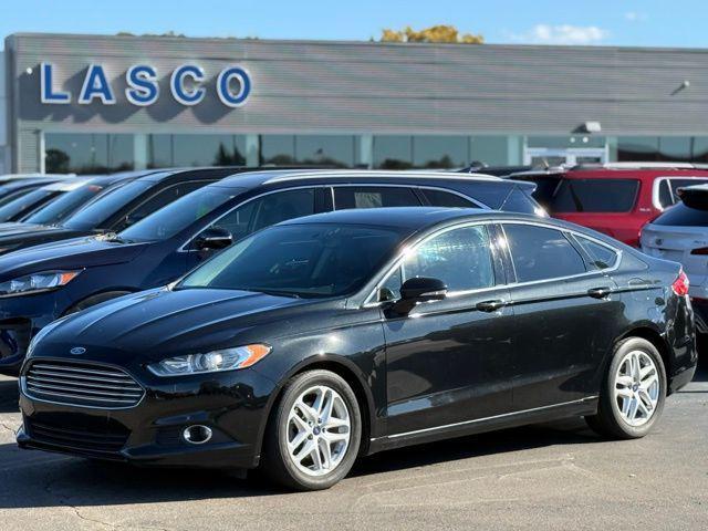 used 2014 Ford Fusion car, priced at $7,000
