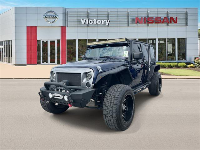 used 2013 Jeep Wrangler Unlimited car, priced at $19,590