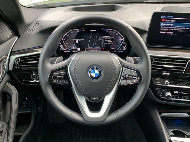 used 2023 BMW 530e car, priced at $33,477
