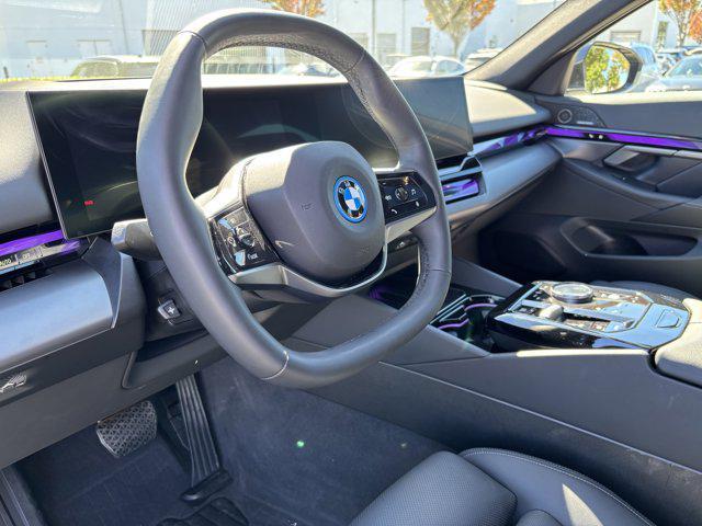used 2024 BMW i5 car, priced at $45,977