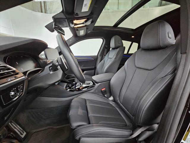 used 2025 BMW X4 car, priced at $56,297