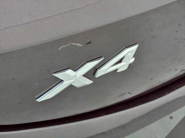 used 2025 BMW X4 car, priced at $52,999