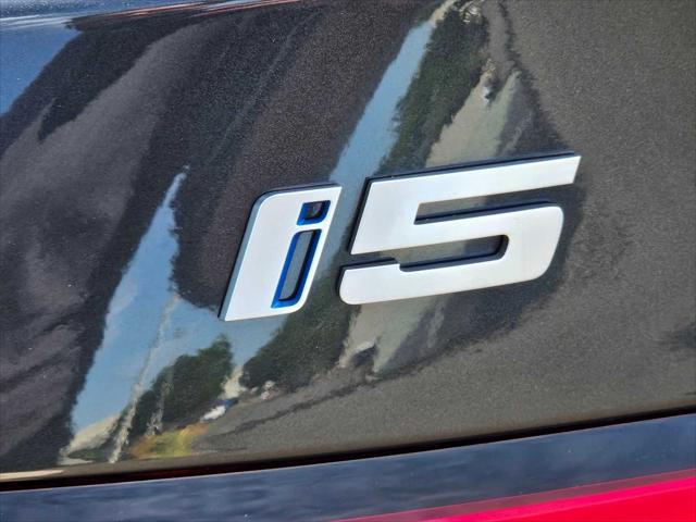 used 2024 BMW i5 car, priced at $61,190