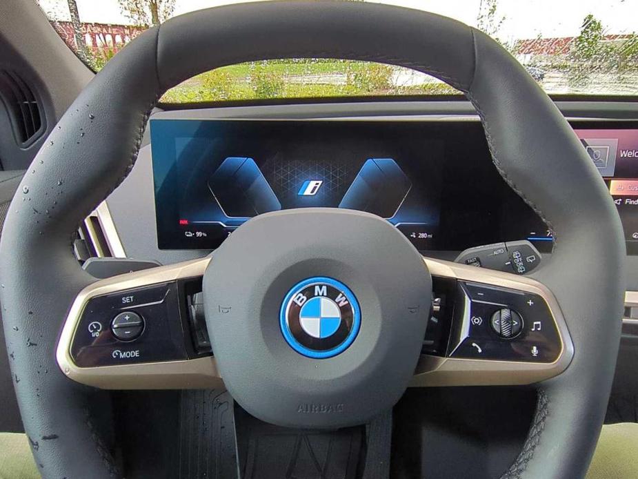 new 2024 BMW iX car, priced at $97,050