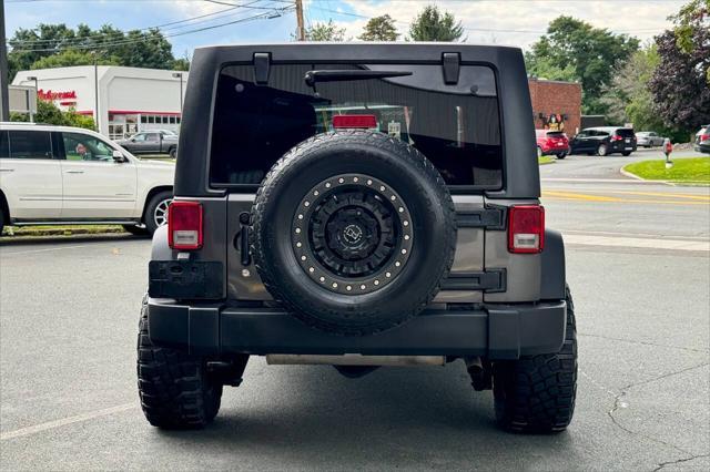 used 2018 Jeep Wrangler JK Unlimited car, priced at $22,997